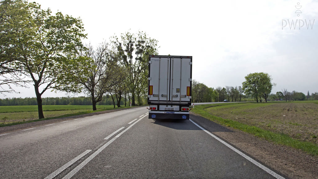 Question illustration: Are you allowed to drive onto the lane designated to vehicles driving in the opposite direction?