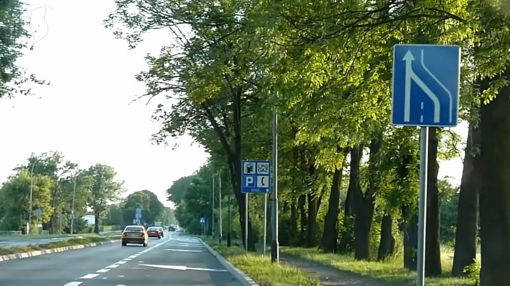 Question illustration: When you're changing lanes, how should you observe the surrounding area?