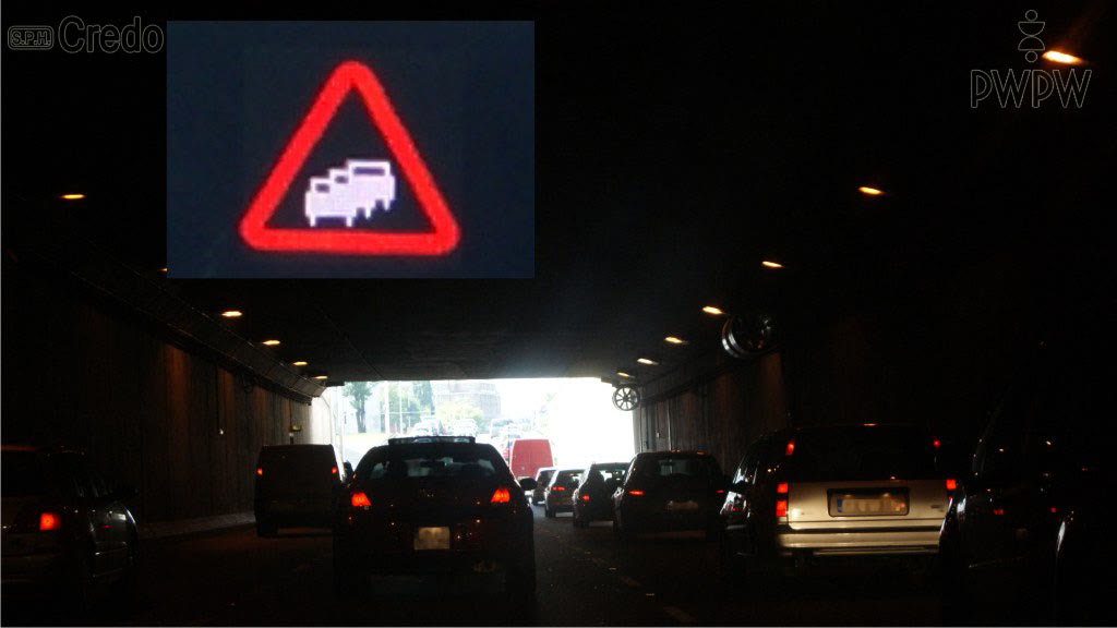 Question illustration: How many metres distance from the preceding vehicle should you maintain when stopping in the tunnel due to a traffic jam?