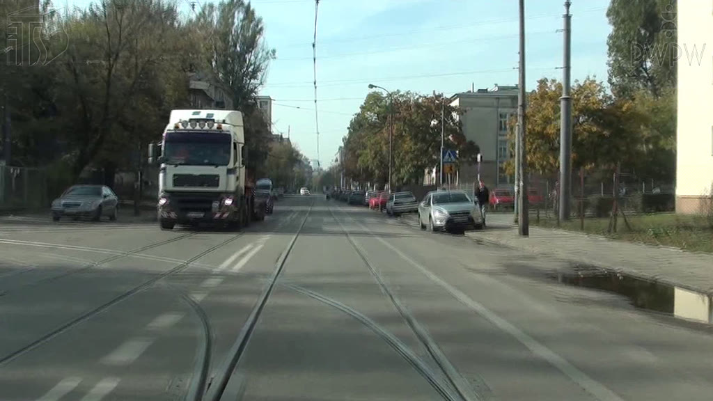 Question illustration: In this situation, turning left to the depot, do you have priority over the vehicle coming in the opposite direction?