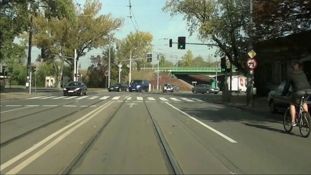Question illustration: In this situation, driving a tram, are you allowed to overtake the cyclist just before the pedestrian crossing sign?