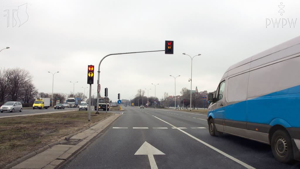 Question illustration: Does the traffic light displayed in this situation allow you to drive beyond the traffic light post?