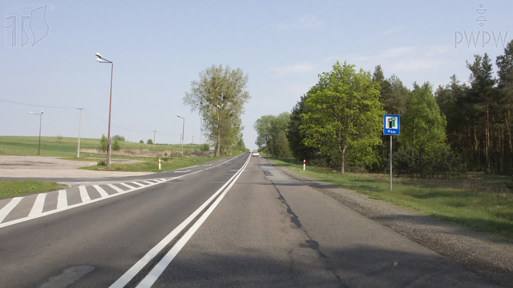 Question illustration: Are you allowed to turn left into the parking space situated by the road?