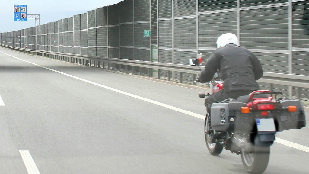 Question illustration: What distance should you maintain when overtaking a motorcyclist?