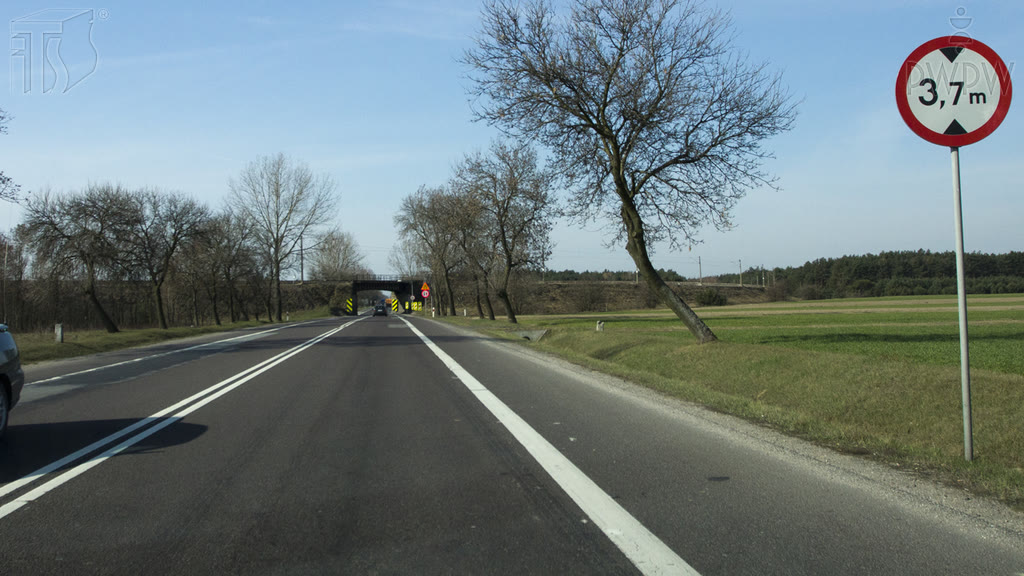 Question illustration: You are driving a vehicle whose height is 2.8 metres, loaded up to the height of 3.8 metres. Are you allowed to drive onto the road beyond this sign?