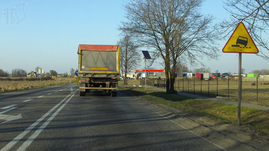 Question illustration: In the presented situation, when pulling over, should you do it carefully and slow down significantly if the need be?