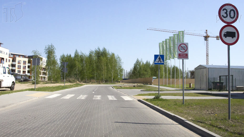 Question illustration: You are driving an agricultural tractor. Are you allowed to drive onto the road beyond these prohibitory signs?