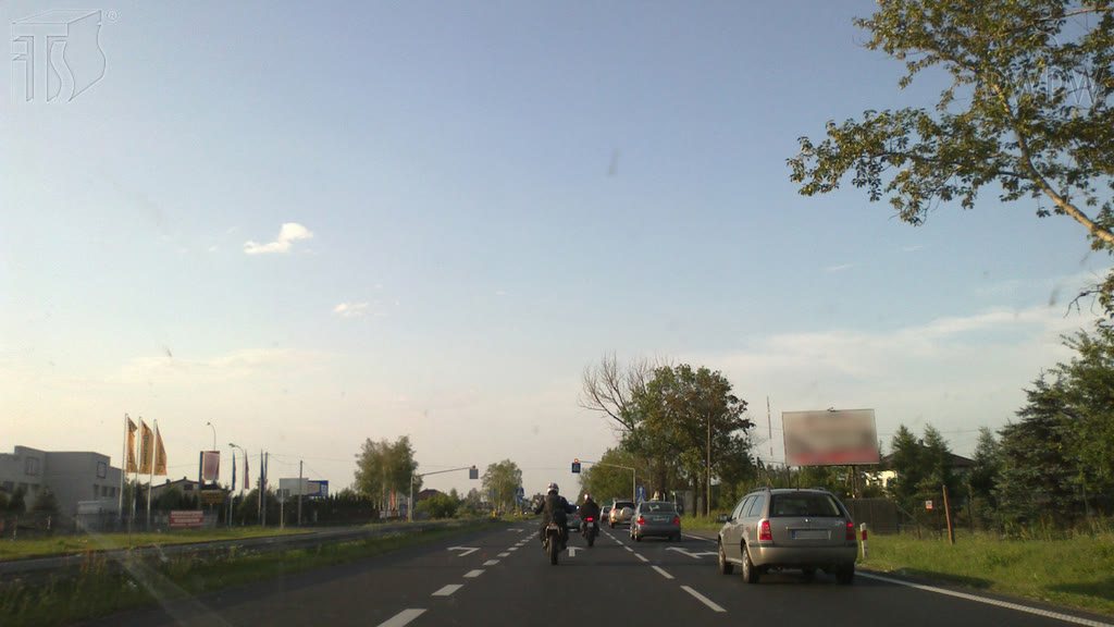 Question illustration: What distance should you keep from a vehicle in front of you if you ride a motorcycle in a built-up area?