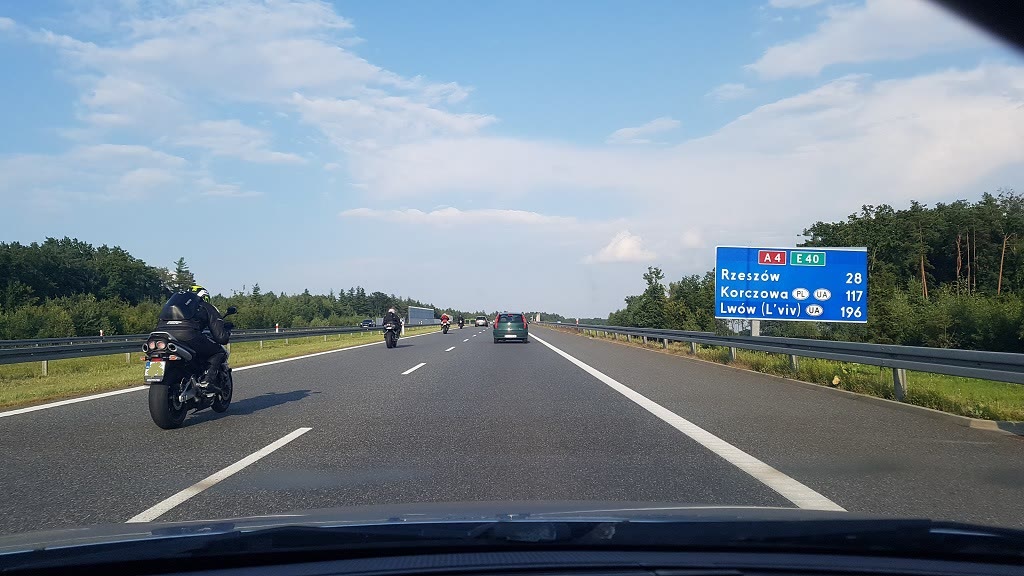 Question illustration: At what speed is a motorbike not allowed to travel on this road?
