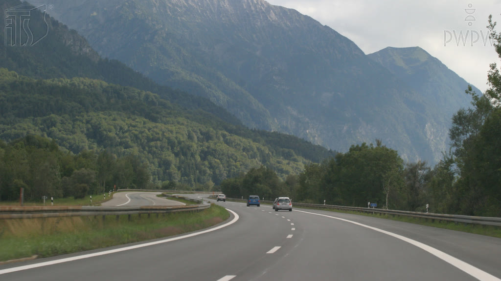 Question illustration: How should you proceed when driving a loaded truck downhill?