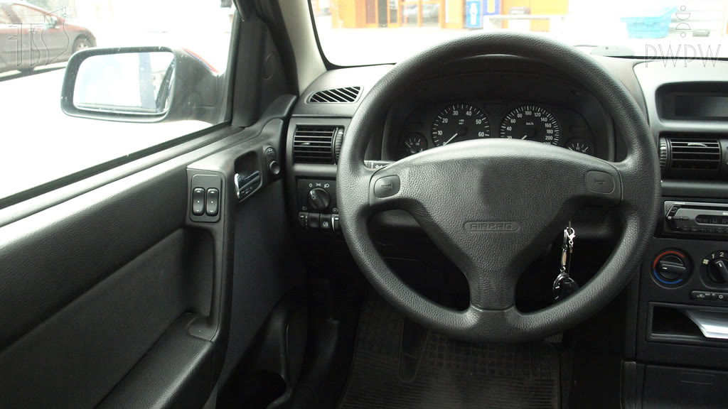 Question illustration: What position behind the wheel will help to reduce the effect of the so-called blind spot in the mirrors which occurs when you watch the road?