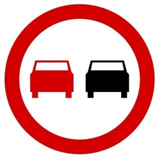 Question illustration: When riding a motorbike, can you overtake a passenger car beyond this sign?