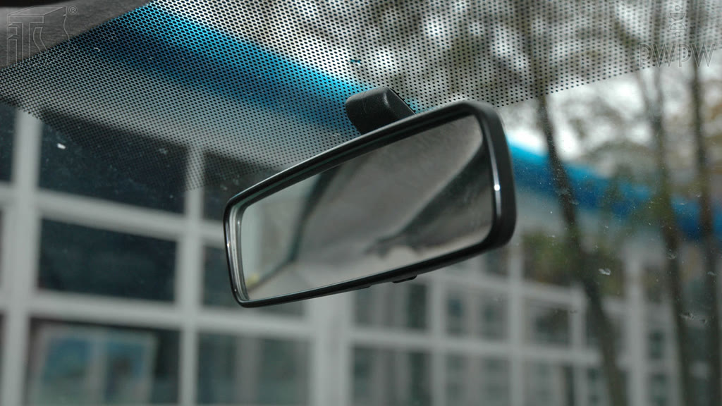 Question illustration: What should you see in a properly-positioned rear-view mirror?
