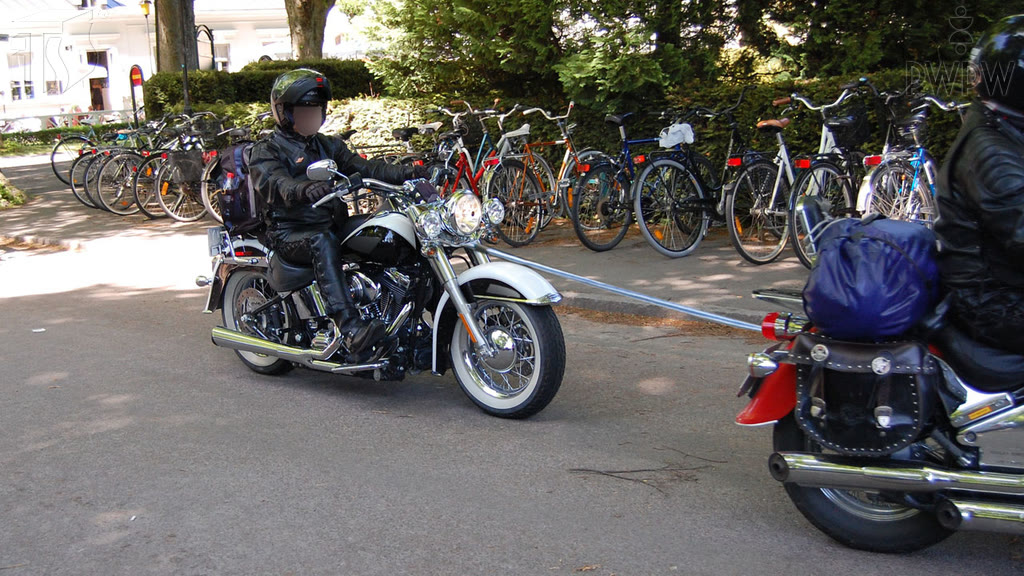 Question illustration: Can you ride a towed motorcycle if you do not hold a motorcycle licence?