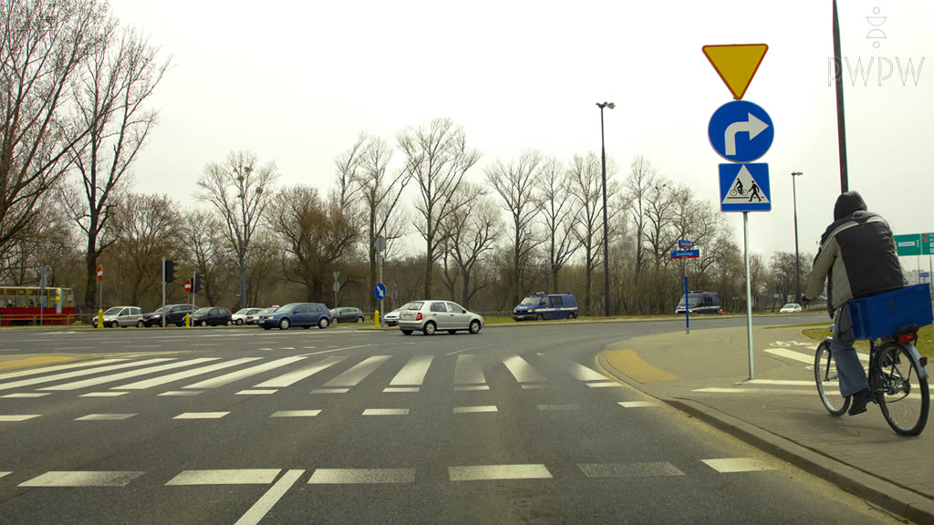 Question illustration: Should you take into account the possibility of a cyclist entering the road in this situation?