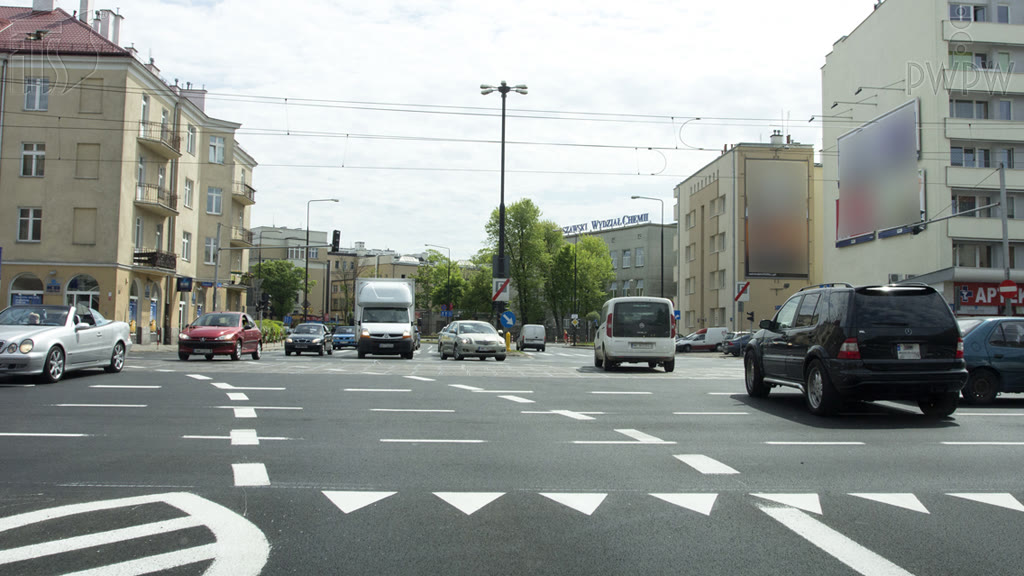 Question illustration: Does the horizontal dotted line visible in this intersection indicate continuation of the traffic lane occupied?