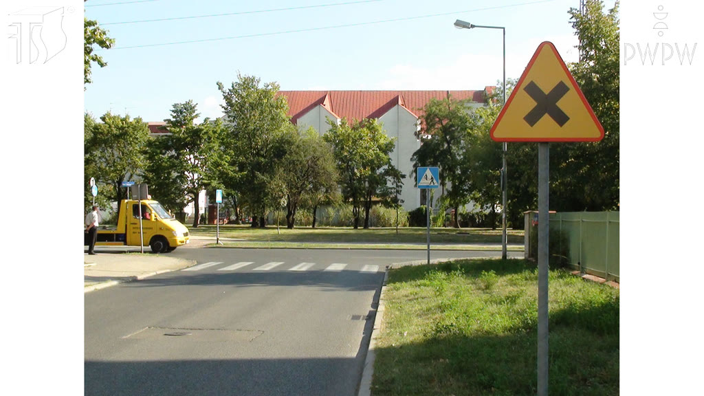 Question illustration: If you turn left at this intersection, do you have the right of way over the vehicle approaching from the left?
