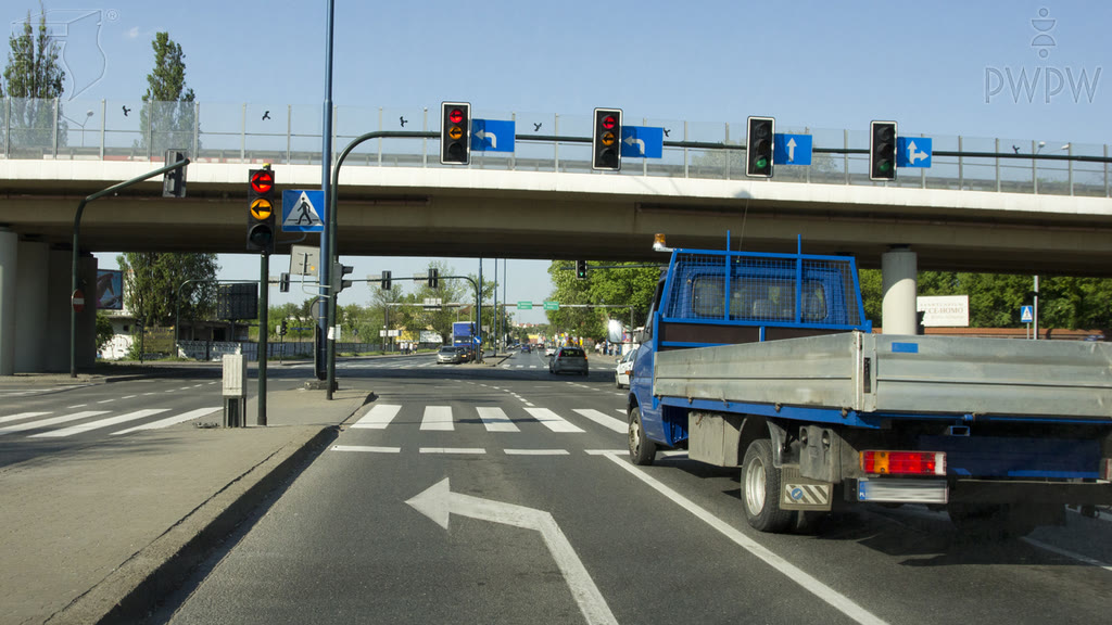 Question illustration: Will you be allowed to make a U-turn at this intersection after the light turns green?