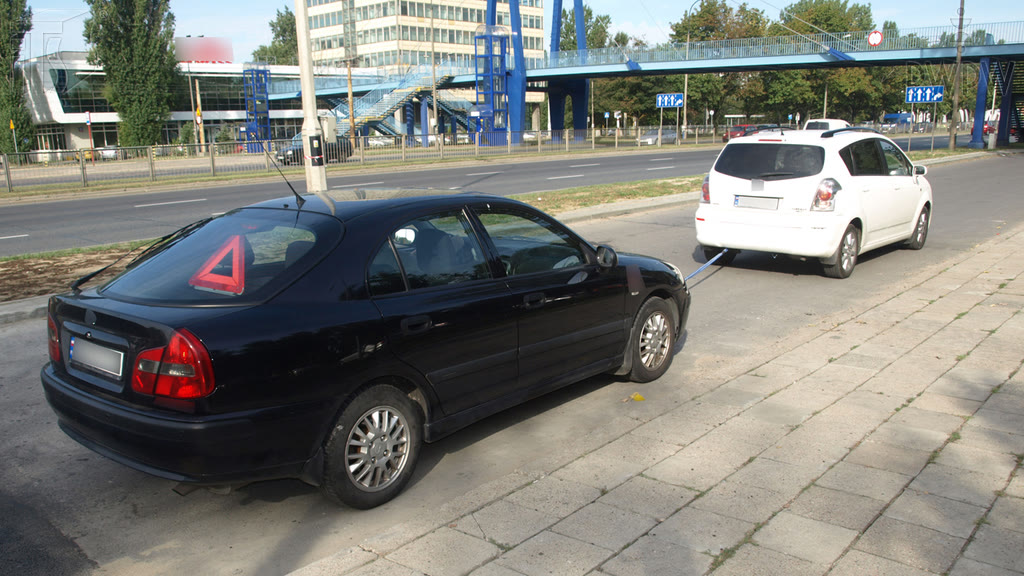 Question illustration: Can you use emergency lights while towing a vehicle?