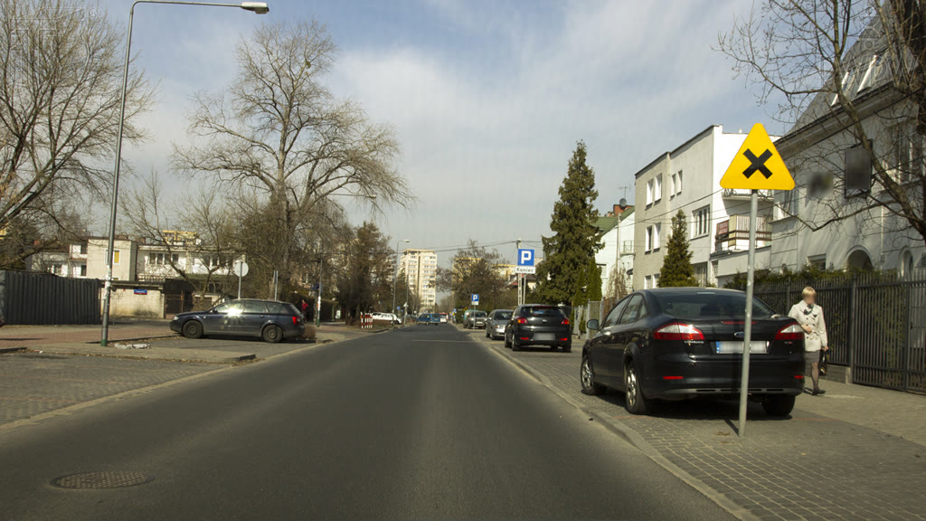Question illustration: When driving at the speed of 50 km/h should you slow down while approaching the closest junction when the situation on the right hand side of the road is not adequately visible?
