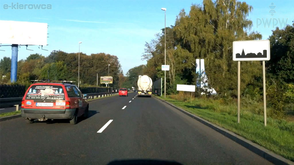 Question illustration: At what maximum speed are you allowed to drive on the road beyond this sign if you are hauling another passenger car?
